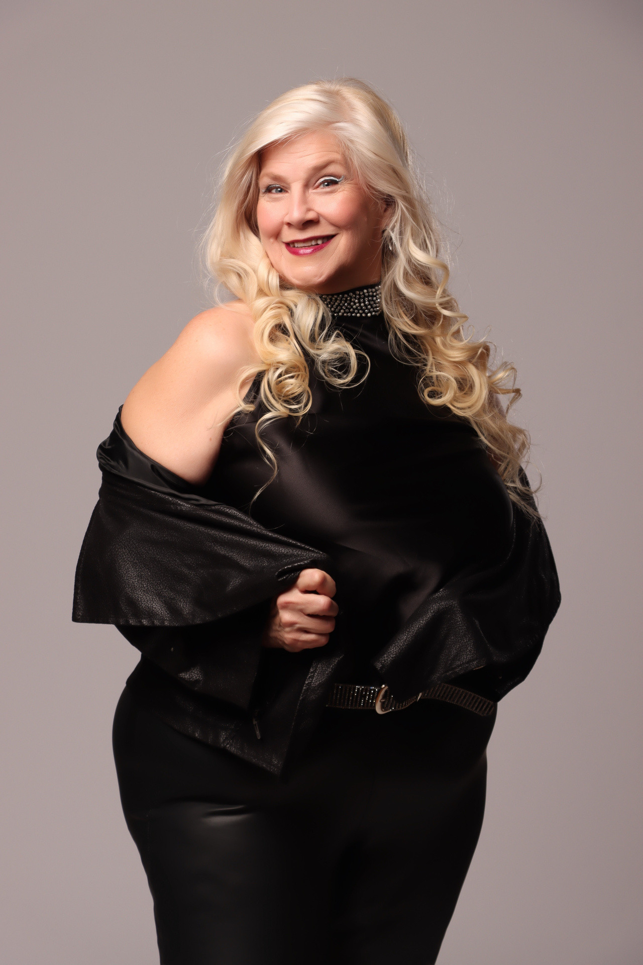 Jamie Eichelberger in a black off-the-shoulder look